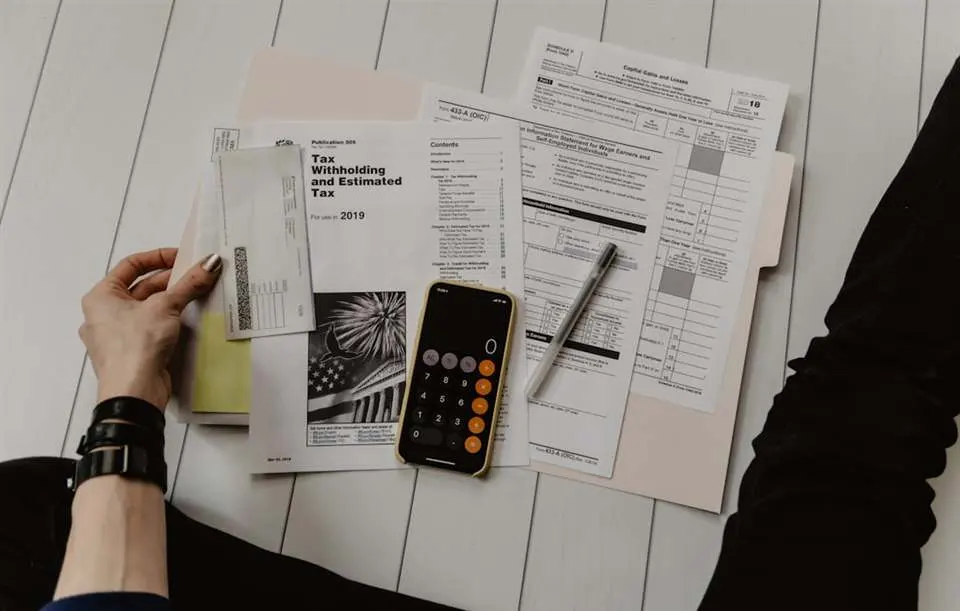 Financial documents and calculator — thinking through accumulation years