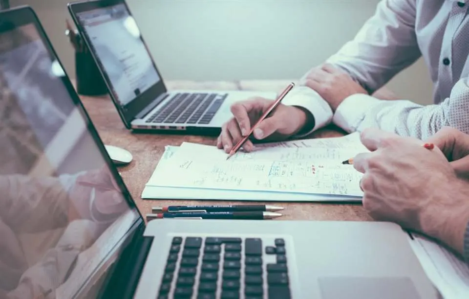 Person reviewing charts and planning notes at a desk